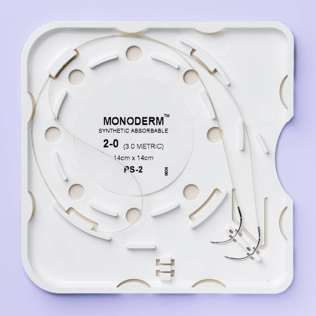 Quill Monoderm box with 2-0 (3.0 metric) suture size and unique 14cm x 14cm length, featuring a PS-2 precision reverse cutting needle. The undyed PGA-PCL monofilament suture is absorbable, with a 3-week wound support capability, sterilized using Ethylene Oxide, and packaged with 12 sutures per box.