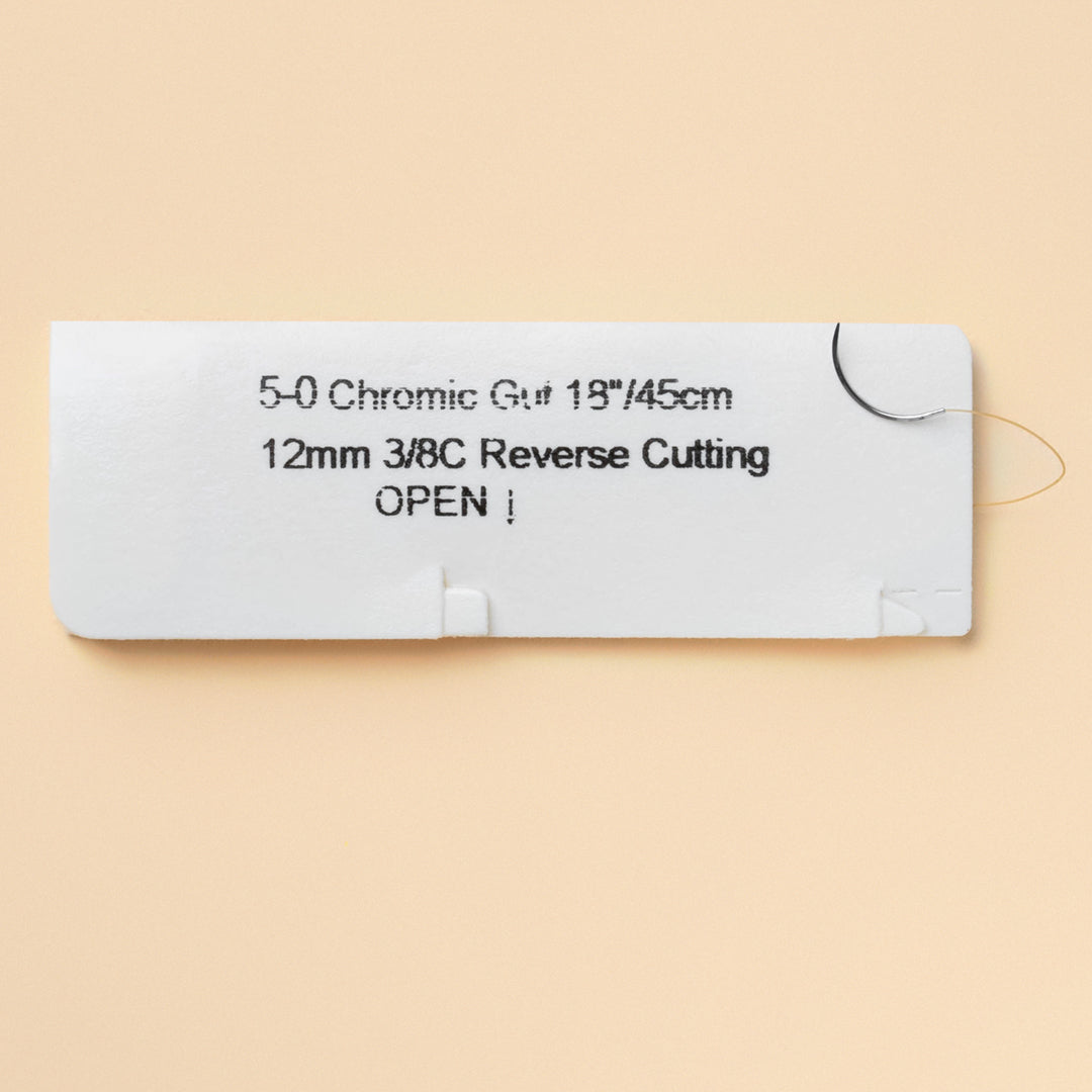 Box of 5-0 Chromic Gut sutures with a C-17 reverse cutting needle, model 563B, emphasizing the 2-week wound support duration and featuring a QR code for easy reference. The packaging highlights its sterility and absorbable nature tailored for effective wound management.